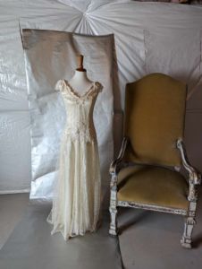 This is a vintage dress offered for rent by Wed Utah that has a subtle drop waist. Notice how the waist drops onto the hips just slightly. Click to rent this dress for your stylized shoot or wedding!